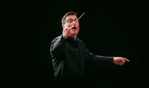 Cal State LA Conductor leading student orchestra in the State Playhouse